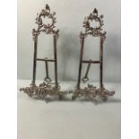 Pair of white metal table top easels each approximately 39cm high