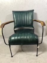 Contemporary style metal framed arm chair with blue green leather upholstery