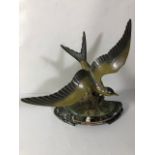 Continental art Deco mantel figure of a flying bird on marble base approximately 42 x 39 cm