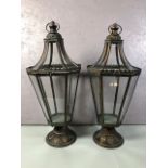 Pair of octagonal patinated metal framed lanterns each approximately 65cm high