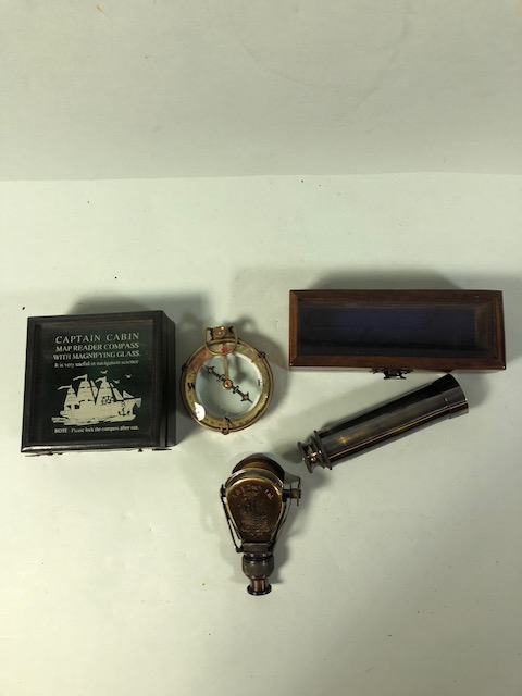 Brass ship style compass in a display box, brass pocket telescope in display box and a fold out