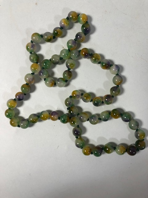 Polished jade type stone bead necklace of mixed colours approximately 40cm