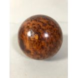 Polished wooden ball made from a tree burr approximately 9cm diameter