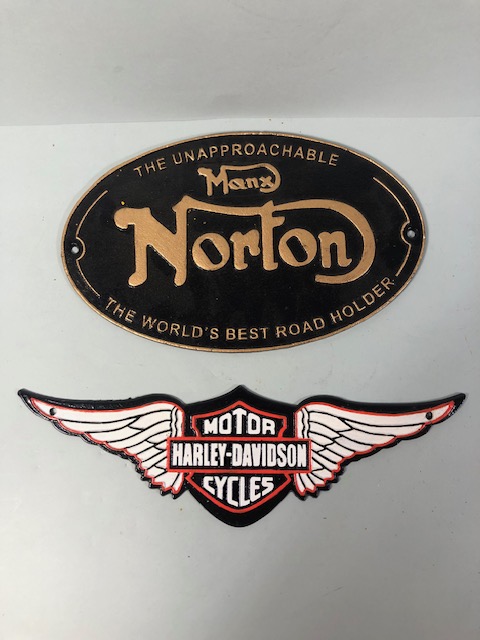 Two cast iron painted motorcycle signs, Harley davidson, Norton each approximately 38cm