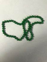 Green stone bead necklace approximately 41cm long