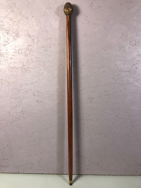 Walking stick toped with 4 face brass buddha head