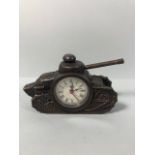 Cast metal clock of bronze finish in the shape of a WW1 tank, winds and runs, approximately 16cm