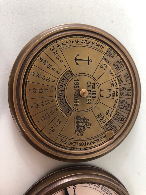 Two larger pocket style compasses one of sundial design the other of calendar design - Image 2 of 6