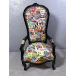 Antique style arm chair with a quirky twist, being upholstered in comic book design material