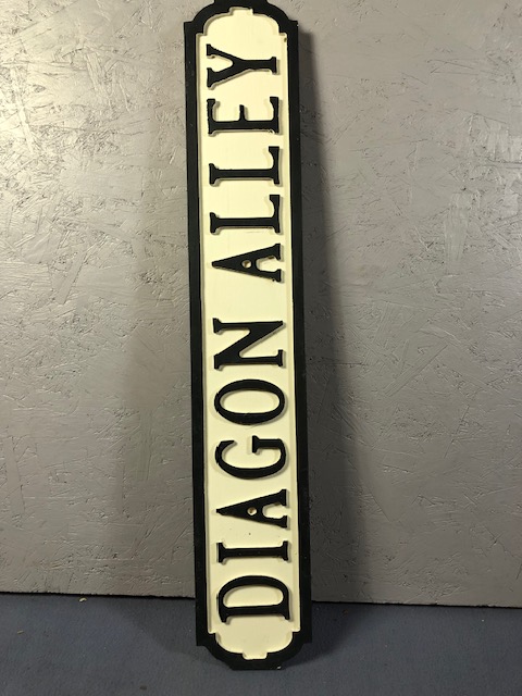 Wooden sign styled as street name plaque DIAGON ALLY, 68cm long