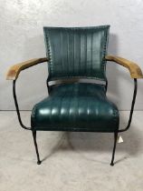 Contemporary style metal framed arm chair with blue green leather upholstery matches previous lot