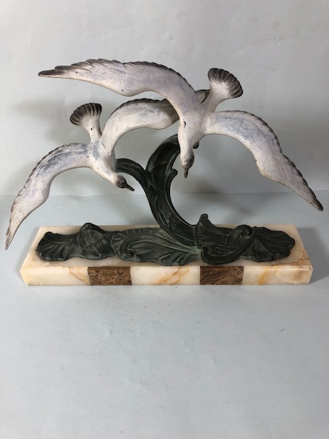 Continental Art Deco Mantel sculpture of 2 gulls soring above the sea, painted metal. mounted on
