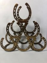 Brass horse shoe wine bottle rack approximately 39 x 40 x13 cm