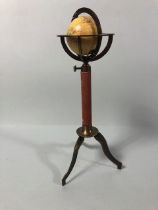 Table top world globe on brass tripod stand approximately 28cm high