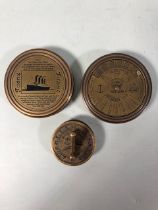 Three different brass cased compasses of nautical interest