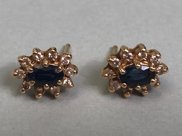 Unmarked gold metal sapphire and diamond cluster earrings approximately 2.20g total