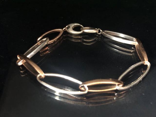 Welsh two colour Clogau Gold bracelet of elongated oval links, marked Clogau with a dragon, 16.6g