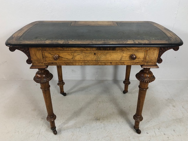 Victorian style Library writing table on casters with leather top on turned and tapering legs with
