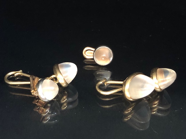 Pair of 14ct Gold set cufflinks set with pyramid cabochon white star sapphires with a pair of