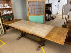 Large Oak extendable Dining table with two leaves on central cross stretcher with heavily carved