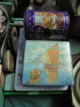 Variety of old tins and pot lid