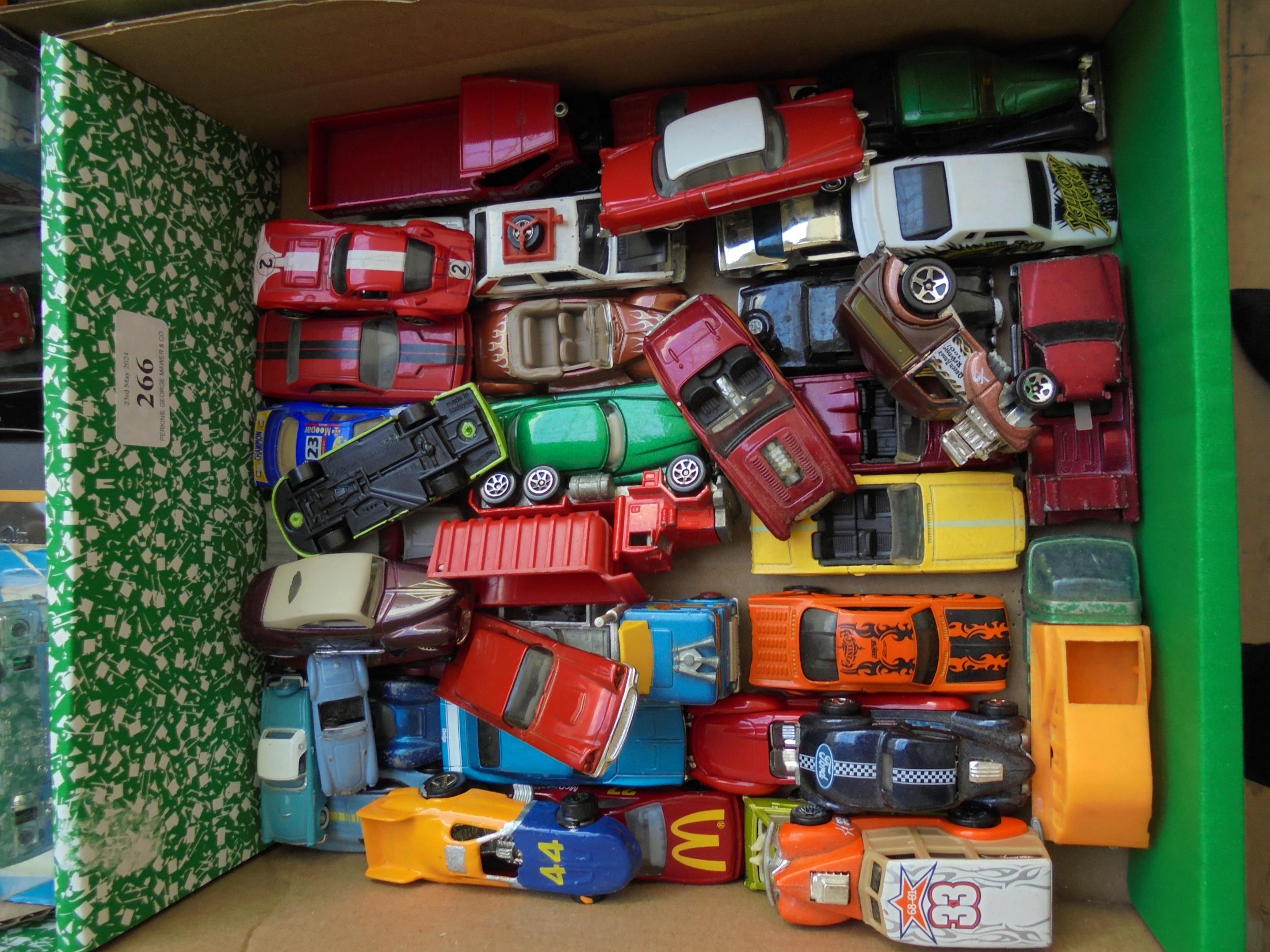 Box of diecast cars and trucks,