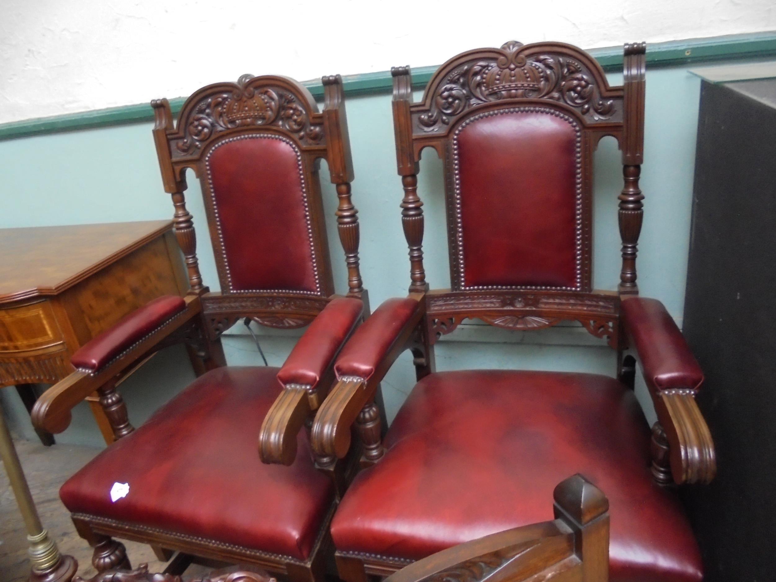 Fine pair of gentleman's polished oak armchairs in quality red leather upholstery to seat,