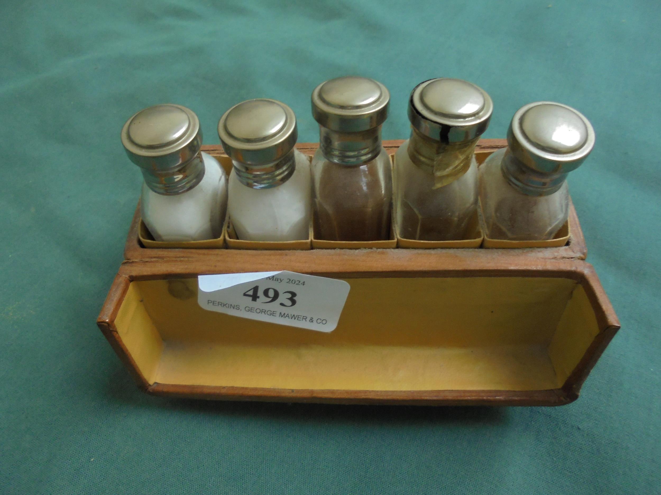 Small leather travelling box containing 5 perfume bottles