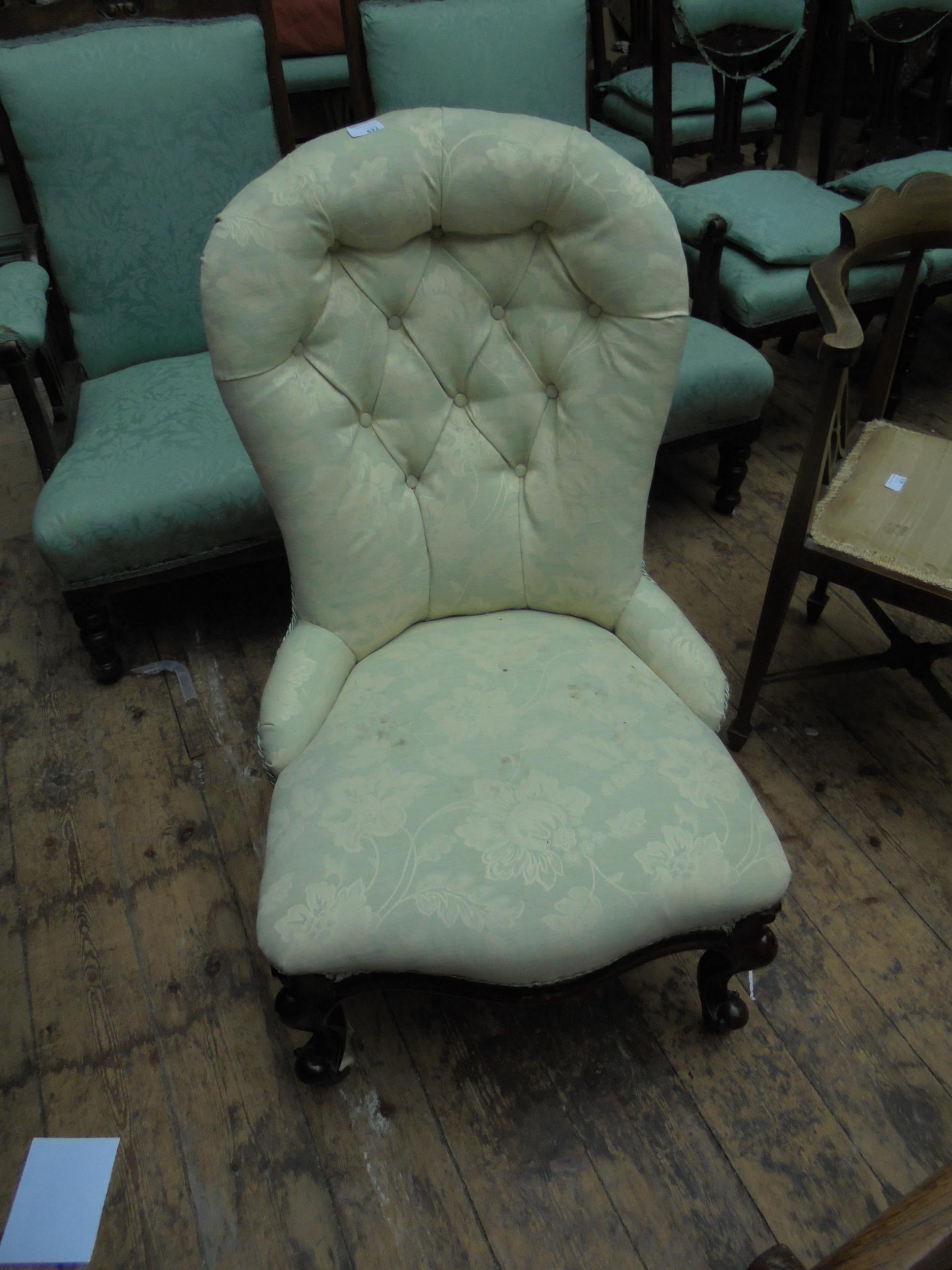 Fabric covered Victorian balloon backed chair on carved legs