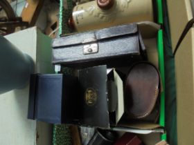 2 leather containers with hair and clothes brushes,