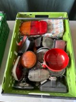 A box of assorted vehicle accessory lights etc.