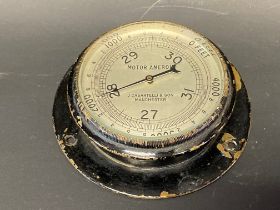 A dash mounted motor aneroid barometer by J. Casartelli & Son of Manchester by repute working but
