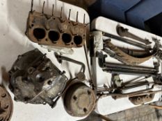 A large selection of mostly Austin Seven spares including a gearbox, engine block, carburettor,