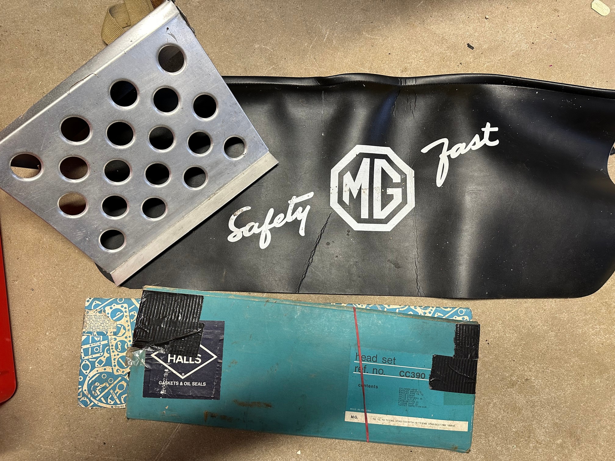 An aluminium rally style passenger foot rest, an MG branded protective bodywork cover, two sets of
