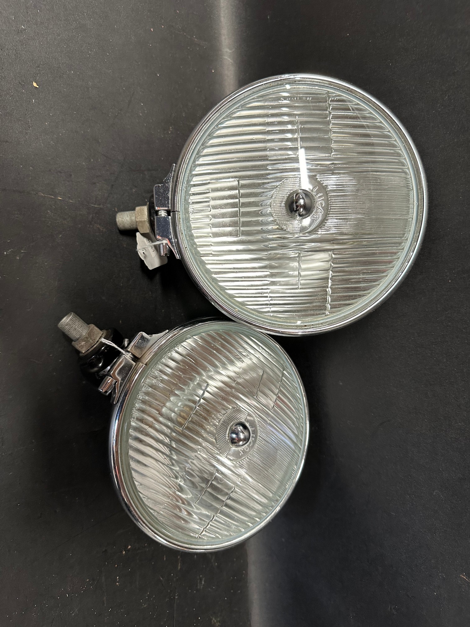 A pair of Lucas commerical lamps.