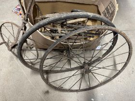 A selection of early wheels from a bath chair, bicycles etc.