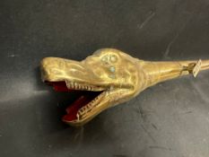 A brass serpent's head horn.