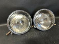 A pair of Lucas Rotax chrome headlights.