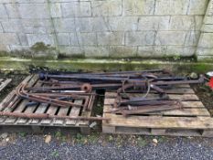 Two pallets of Ford Model T chassis rails, dry shafts, steering columns etc.