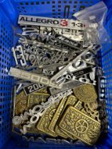 A tray of car badges.