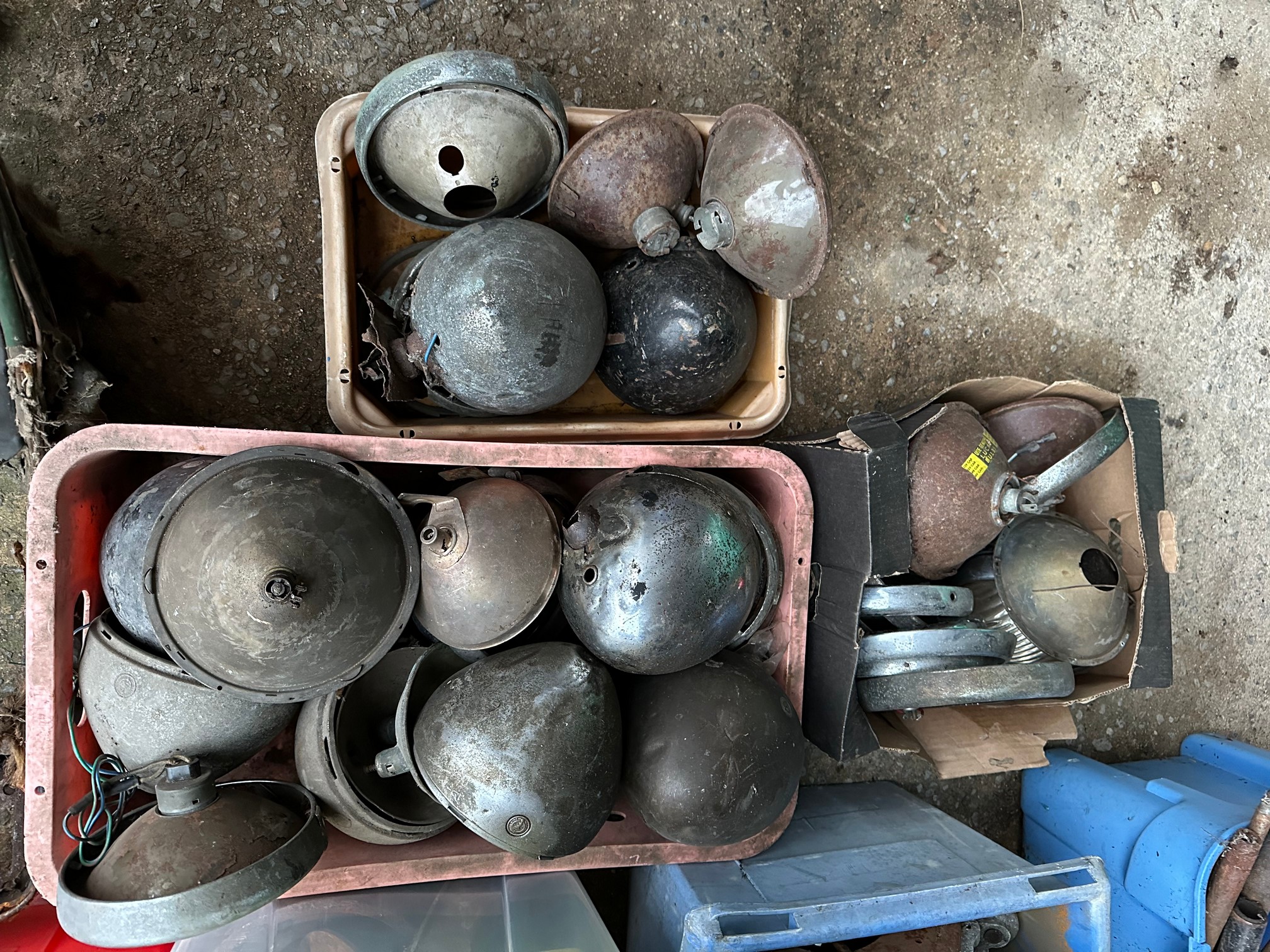 Three trays of Austin Seven headlamp parts.