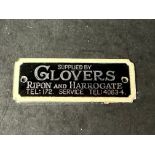 An enamel supplier dashboard plaque, badge, emblem for Glovers of Ripon and Harrogate, made by J.