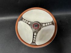 A Beswick Les Leston Lmited Cooper dish in the form of a steering wheel.