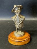 A motorcycle/car accessory mascot depicting Wee Jamie for Douglas Motor Company, wooden display base