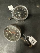 A Cooper Stewart eight day car clock and a Smiths MA car clock, both bottom wind.