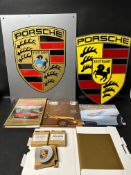 A Porsche owner's bundle to include signs, books and three wheel centre caps.
