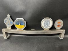 A badge bar holding four car badges: RAC, TSCC, V.B.R.A Builders and Repairers Assoc'n Vehicle and