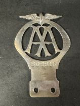 A motorcycle AA badge, no. 802813, dates May 1928-Nov 1929.