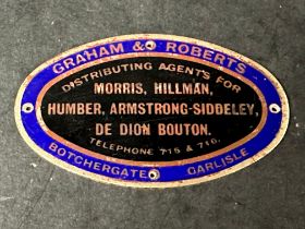 An enamel supplier dashboard plaque, badge, emblem for Graham & Roberts of Carlisle, agents for