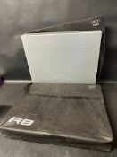 Two Audi R8 exclusive boxed books with original outer bags.